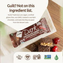 Load image into Gallery viewer, NuGo Dark Chocolate Cherry protein bar on a wooden surface with branding and certification logos.