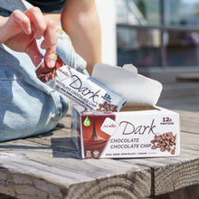 Load image into Gallery viewer, Woman holding Chocolate Chip bar over the box
